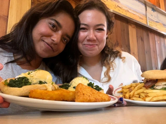 Picture of Nandini and a friend enjoying a meal together