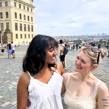 Picture of Aruna and her friend in a town square in Prague