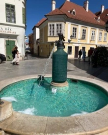 Fountain with blue water in a town square